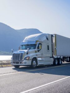 Big rig semi truck with chrome accessories transporting frozen c